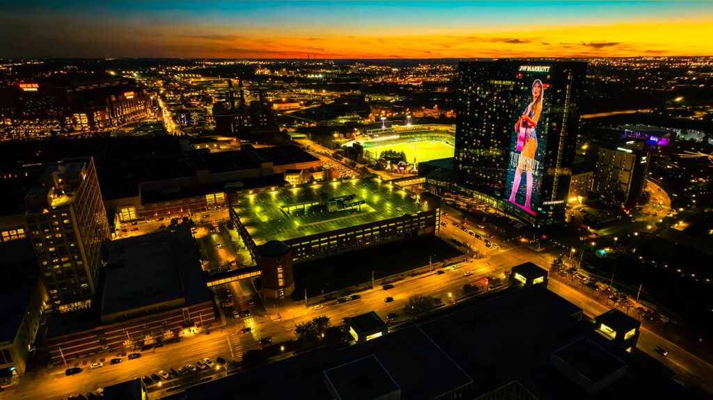 Downtown Indy at dusk with a sunset over the horizon